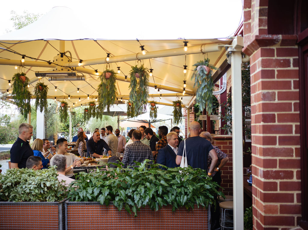 People celebrating a corporate Christmas party at The Island at Elizabeth Quay in Perth